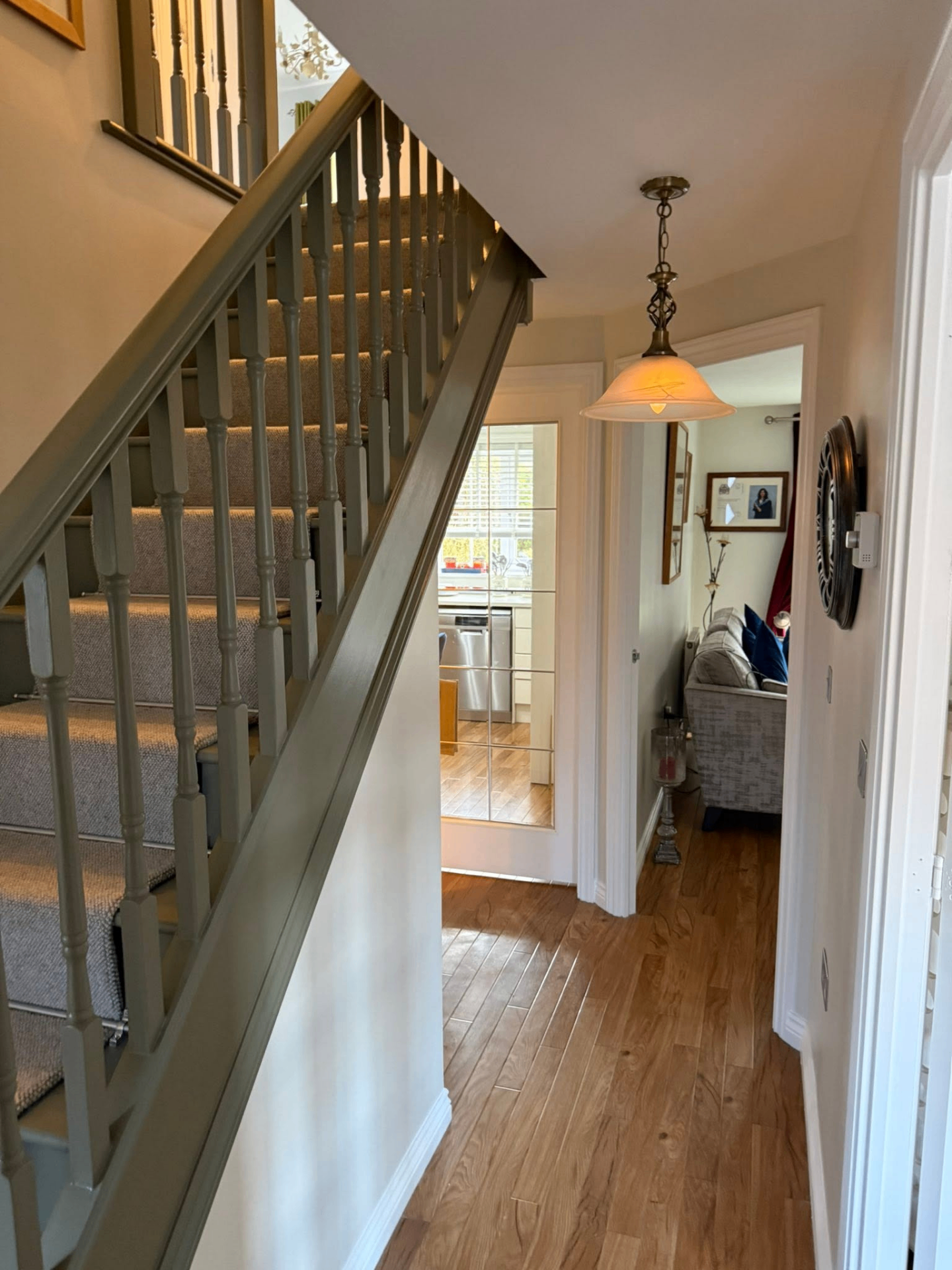 Warm staircase view to kitchen